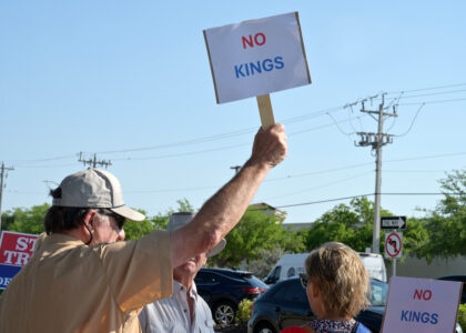 article image - Protesters carry No Kiings signs to a rally held Saturday in Cape Coral. CASEY BRADLEY GENT – Breeze Newspapers